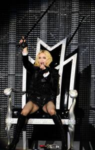 Pop queen Madonna sceptred and throned during a performance