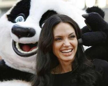 Angelina Jolie with a panda character during the DVD release of 