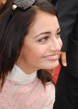 Endearing beauty Dia Mirza smiles for shutterbugs at a media event.