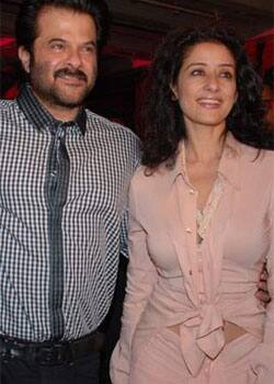 A cheerful reunion: Actor Anil Kapoor and Manisha Koirala smile for shutterbugs at a media event.