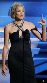 Actress Sharon Stone gestures, making an 'L' with her fingers, as she speaks about actor Samuel L.