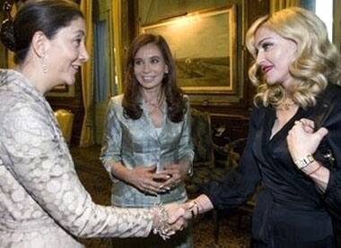 French-Colombian former FARC hostage Ingrid Betancourt shakes hands with Madonna.