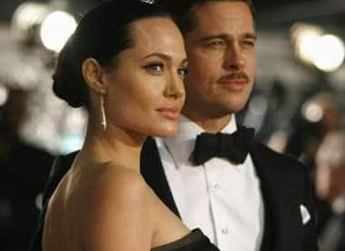 Brad Pitt and Angelina Jolie pose at the premiere of 