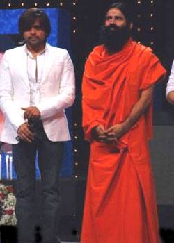 Singer-actor Himesh Reshammiya welcomes Baba Ramdev on the sets of 'Sa Re Ga Ma'.