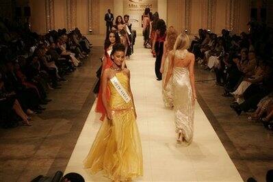 Miss South Africa, Tansey Coetzee, leads contestants during the Miss World Fashion Show and Top Model competition in Soweto, South Africa