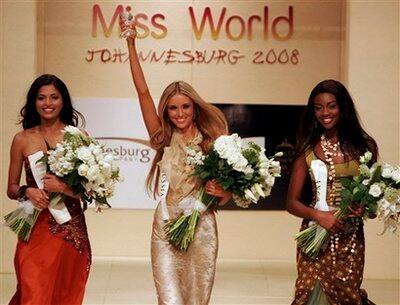 Winner, Miss Russia Kseniya Sukhinova, center, flanked by second runner up Miss Angola, Micaela Reis, right, and runner up Miss India, Parvathy Omanakuttan, left, seen during the Miss World Fashion Sh