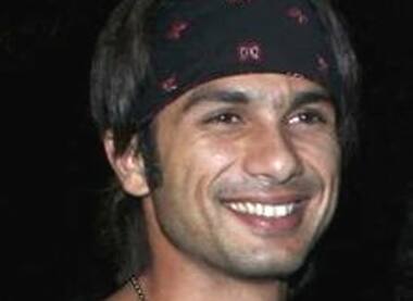 Shahid Kapur smiles during the launch of a hairstyling saloon in Mumbai. 