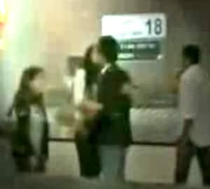 Public display of affection: Lovebirds Deepika Padukone and Ranbir Kapoor lock lips at the Bangkok airport.