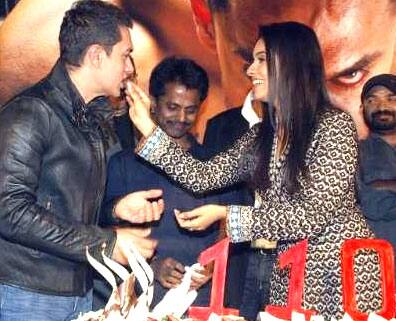 Party time: Aamir Khan and Asin celebrate the astounding success of 'Ghajini'.