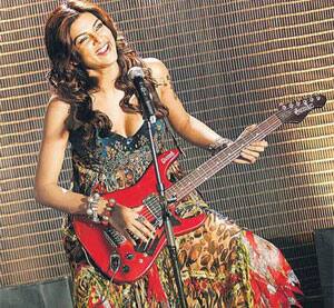 Gorgeous Sushmita Sen plays the chords for Dabboo Ratnani's Calendar 2009. 