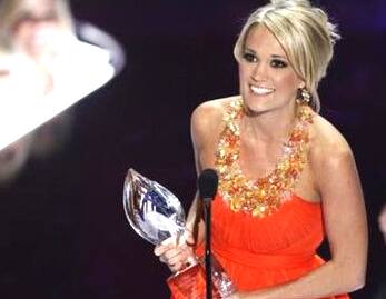 Carrie Underwood bags the award for Favorite Female Singer at the 35th People's Choice awards in LA.