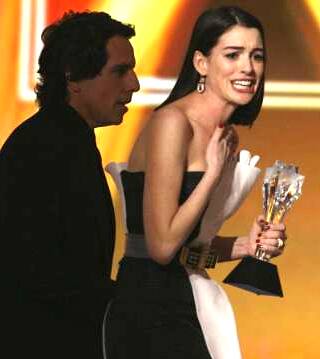 Hathaway accepts the Best Actress award for 