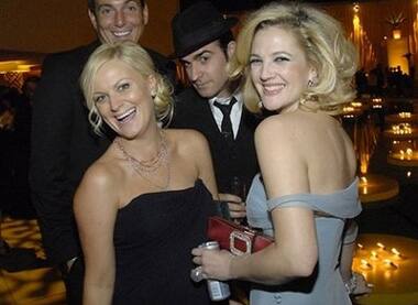 Golden, boozy grins: Amy Poehler, actor Will Arnett and actress Drew Barrymore enjoy Golden Globe after-party.