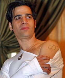 Posing peace: Israeli singer Aviv Geffen shows his peace tattoo in Berlin