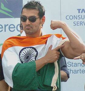 Goodwill power: Jaohn Abraham flaunts his biceps during the Mumbai Marathon.