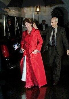 First lady Laura Bush is escorted to the presidential limousine for an evening of inaugural gala in Washington