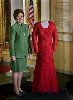 First lady Laura Bush stands next to the her inaugural gown after it was prestented to the Smithsonian National Museum of American History.