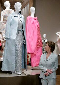 First Lady Laura Bush views the dress, designed for her by Oscar de la Renta, that she wore to the 55th Presidential Inaugural Balls in Washington D.C.