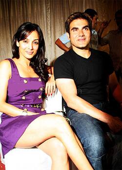 Long legged beauty Malaika Arora Khan with husband Arbaaz Khan at a media event.