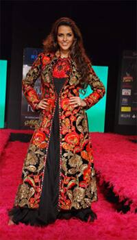 Bollywood actress Neha Dhupia takes the ramp for designer Rohit Bal.