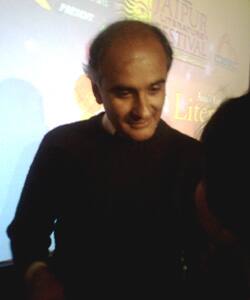 Pico Iyer signing autographs for eager fans.