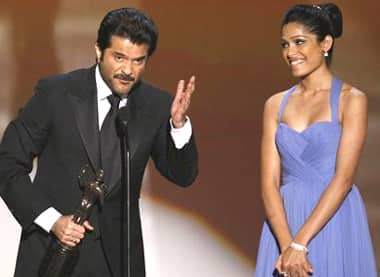 Anil Kapoor and Freida Pinto accept the award for Outstanding Performance by a Cast in 