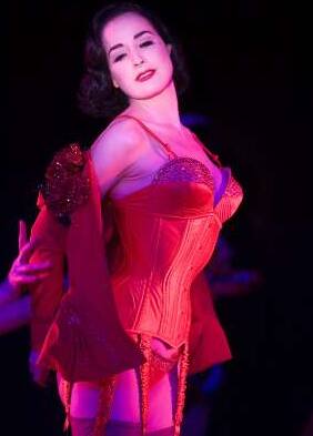 Dita Von Teese performs her number 'Lazy' during a rehearsal for her show at the Crazy Horse cabaret in Paris.