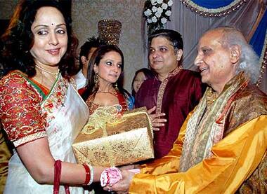 Hema Malini greeting classical singer Pandit Jasraj on his 80th birthday in Mumbai.