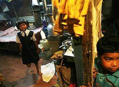 Slumdog irony: Rubina, child artist of Slumdog at her slum-home.