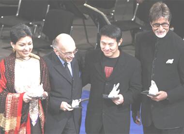 Davos forum's Crystal Award winners Mallika Sarabhai and Amitabh Bachchan flank Jose A. Abreu and Jet Li.