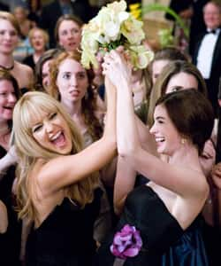 Becoming brides Kate Hudson and Anne Hathaway in a scene from “Bride Wars”.