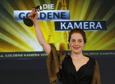 Paula Kalenberg poses with the German TV 'Goldene Kamera' (Golden Camera) media award as best national upcoming actress in Berlin.