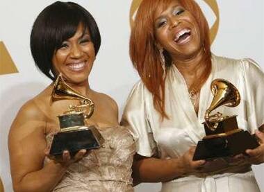 Members of Mary Mary pose backstage after winning Best Gospel Performance for 'Get Up' at Grammy Awards in LA.