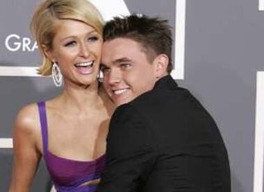 Paris Hilton gets a surprise hug from Jesse McCartney as she arrives at the 51st annual Grammy Awards in LA.