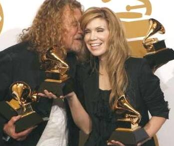 Robert Plant and Allison Krauss hold their awards for Album of the Year for 