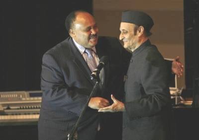 Martin Luther King III, son of Rev. Martin Luther King Jr., left, greets Indian law maker Karan Singh, at the `Living Dream Concert` in New Delhi, India, Monday, Feb. 16, 2009. The concert was held to