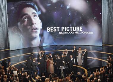 Cast and crew celebrate after 'Slumdog Millionaire' won Best Motion Picture Oscar.