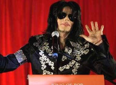 Michael Jackson gestures during a news conference at the O2 Arena in London. 