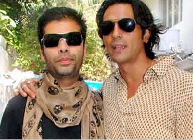 Shades of bonhomie: Karan Johar and Arjun Rampal share a warm moment together.