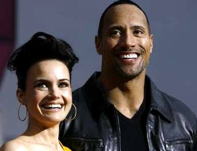 Carla Gugino and Dwayne Johnson at the premiere of 