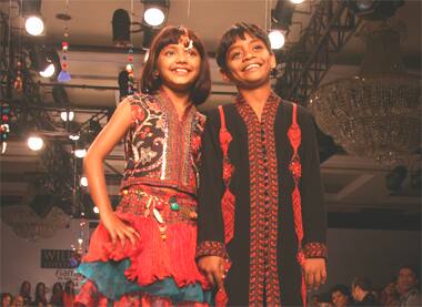 Rubina and Azharuddin, the child stars of Oscar winning film 'Slumdog Millionaire' walk the ramp at WIFW.