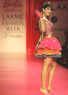 Katrina Kaif wearing a creation by Nishka Lula as she walks the ramp during a show to commemorate 50 years of Barbie. 