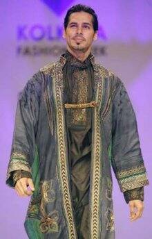 Dino Morea presents a creation from Indian designer Sharbari Dutta during Kolkata Fashion Week in the eastern Indian city of Kolkata April 2, 2009.