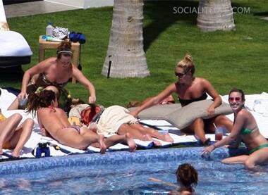 Jessica Simpson and her gang of girls hang by a poolside during her Mexico vacation