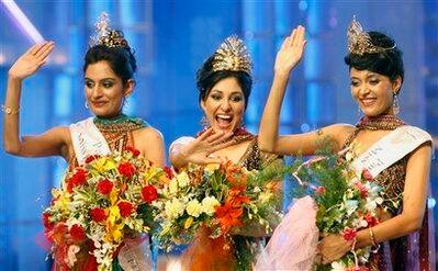 Winners of the Femina Miss India 2009 contest, from left, Miss Universe Ekta Chaudhary, Miss World Pooja Chopra and Miss Earth Shriya Kishore gesture after being declared winners in Mumbai, India.