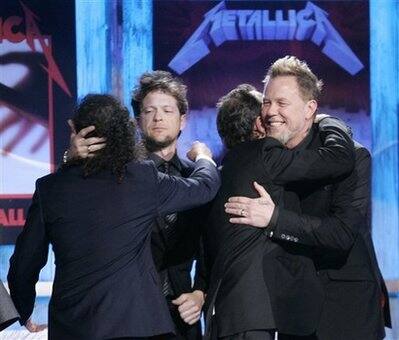 Metallica members Lars Ulrich, Jason Newsted, Kirk Hammett and James Hetfield celebrate as they are inducted into the Rock and Roll Hall of Fame at the 2009 Rock and Roll Hall of Fame Induction Ceremo