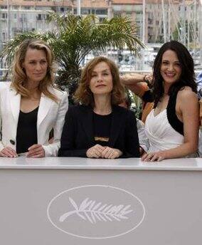 Jury members of the 62nd Cannes Film Festival U.S. actress Robin Wright Penn (L) and Italian actress Asia Argento pose with jury president and French actress Isabelle Huppert (C) during a photocall in