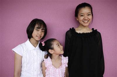 South Korean actresses Do Yeon Park, left, Sae Ron Kim, center, and A Sung Ko, right, pose for photographs during the 62nd International film festival in Cannes