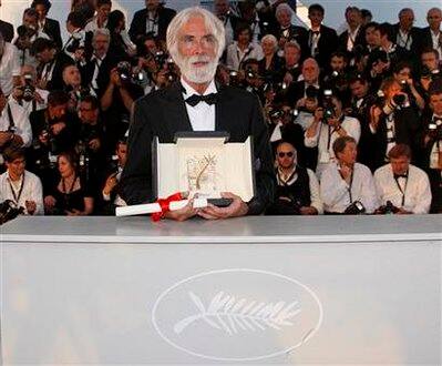 Director Michael Haneke attends a photocall after receiving the Palme d'Or award for the film 