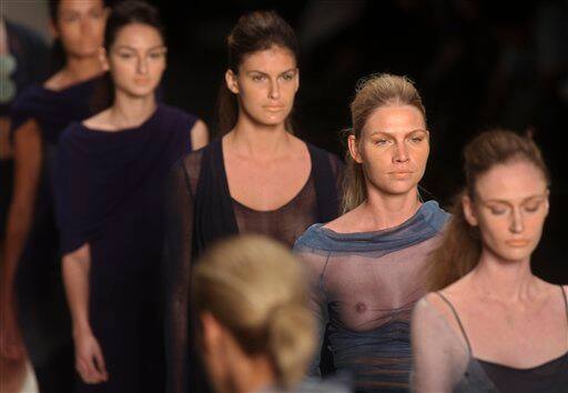 Models wear designs from the Spring-Summer 2009 collection by Mara Mac, during the Rio Fashion Week in Rio de Janeiro